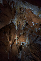 Crystals on speleothemes in a cave