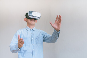business man using virtual reality headset. Isolated on gray background studio portrait. VR, future, technology, education online, studying .  Studio shot on gray