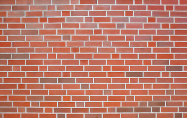 Wall made of red bricks and light gray joints, background image - 538136130