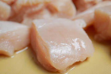  raw breast chicken meat on a plate on white background