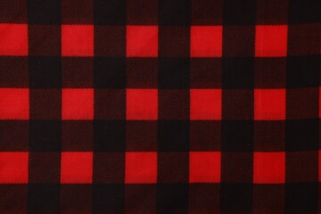 Top view of red bandana with check pattern as background