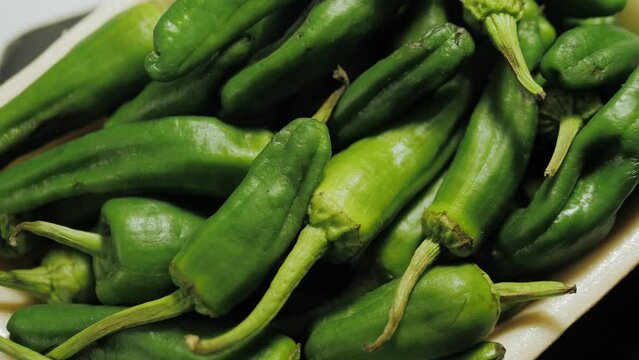 Traditional Spanish patron peppers, green padrons tapas.