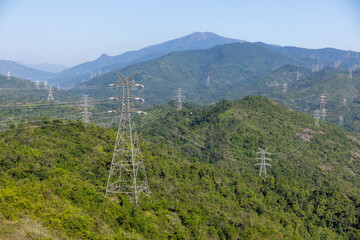 Fototapeta na wymiar High voltage powerline on the mountain