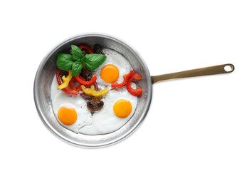 Tasty fried eggs with vegetables in pan isolated on white, top view