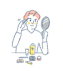 メンズメイクをする若い男性