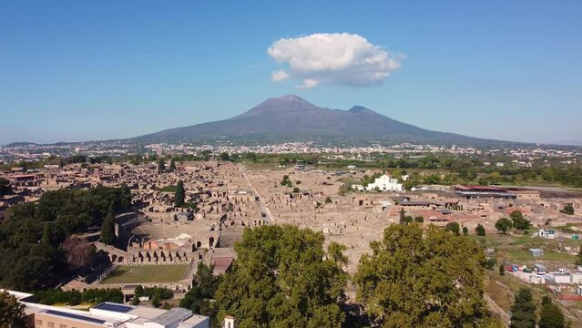 Pompei, Itay: Aerial drone footage of the famous Pompeii archaeological old city by the Vesuve volcano in Napoly, or Naples, in Italy on a sunny day. 