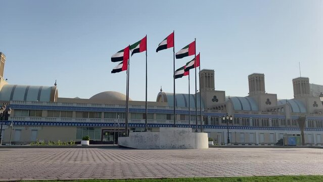 Sharjah, UAE - October 5, 2022: United Arab Emirates flags waving at Central souk or Blue souk