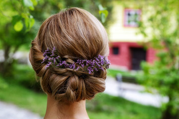 Beauty wedding hairstyle with flowers in hair. Bride.