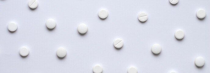 Medical background of many tablets or pills on a white background. Medical pharmacy and medicine...