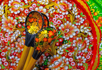 Wooden spoons with a bright pattern in the technique of Russian Khokhloma.