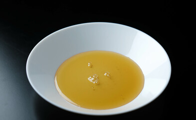 The honey on the plate looks like a fried egg.