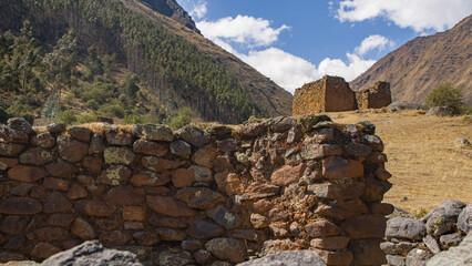 Inca stone wall and andean landscape Pumamarka Cusco Peru