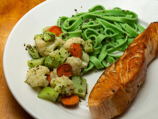 grilled salmon with fettuccini and salad