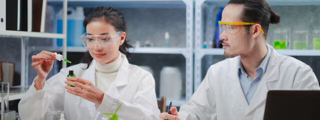 A Female Scientist is dropping the test of the result of laboratory eco or natural cosmetic,...