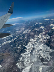 View of the Rocky Mountains from airplane window.