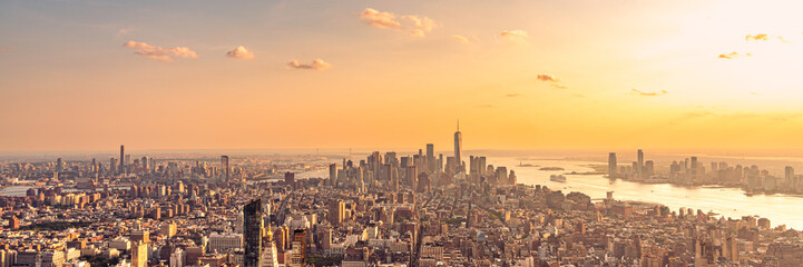 Fototapeta na wymiar Golden sunset panorama aerial view of New York skyscrapers on Manhattan island