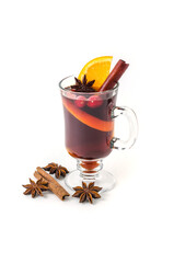 Mug of hot Christmas mulled wine with spices and oranges on a white background
