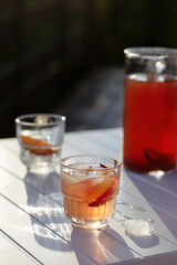 Iced peach tea with ice on a hot summer day