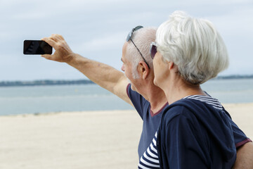 senior happy couple taking selfie