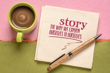story - the way we explain ourselves to ourselves, handwriting on a napkin  with a cup of coffee, storytelling, communication  and interpretation of reality concept