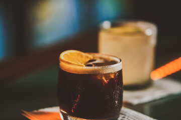 PREPARED COFFEE DRINK WITH COFFEE LIQUOR, AND A SLICE OF ORANGE. CARAJILLO OF A BAR IN THE BAR.