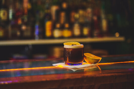 PREPARED COFFEE DRINK WITH COFFEE LIQUOR, AND A SLICE OF ORANGE. CARAJILLO OF A BAR IN THE BAR.