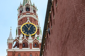 Large clock-chimes on the Kremlin's Spasskaya Tower and part of a brick wall. copy space for text