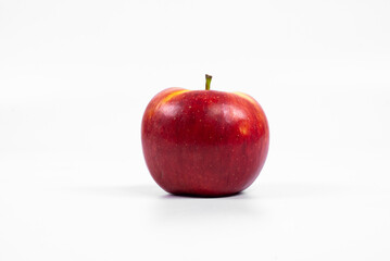 Red apple on the table. On a white background