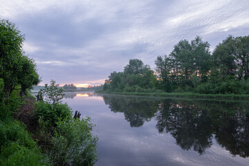 Obraz premium sunset over the river