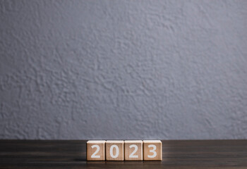 Wooden cubes. 2022 and 2023 are new years. Number on the blocks.