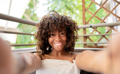 Attractive african girl with vitiligo taking a selfie at spa -  Beauty treatment and leisure concept