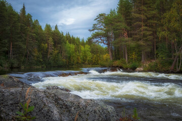 Northern turbulent river beyond the Arctic Circle. Stream on threshold of Kolva or Kolvitsi in...