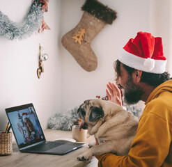 One woman doing video call on laptop with his old dog pug best friends and happy woman on the other...