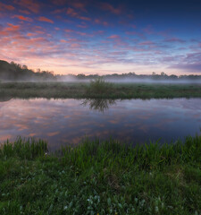 Beautiful spring sunrise over river bank. nature of Ukraine
