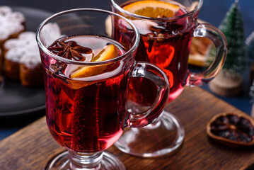 Hot mulled wine with a slice of orange, with cinnamon, cloves and other spices