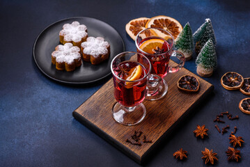 Hot mulled wine with a slice of orange, with cinnamon, cloves and other spices