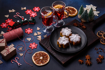 Hot mulled wine with a slice of orange, with cinnamon, cloves and other spices