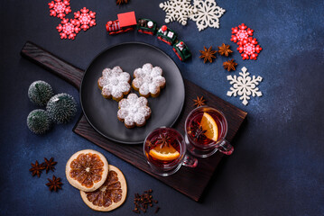 Hot mulled wine with a slice of orange, with cinnamon, cloves and other spices