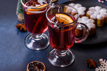 Hot mulled wine with a slice of orange, with cinnamon, cloves and other spices