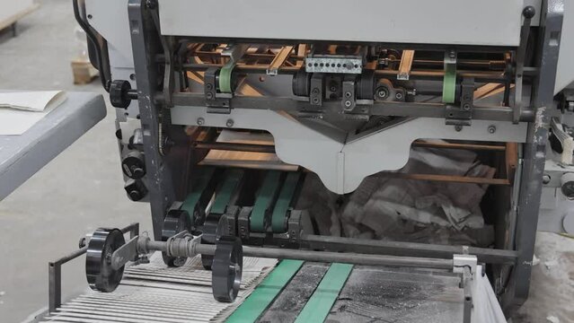 Conveyor Belt With Folded Pages Book Making Production Exit