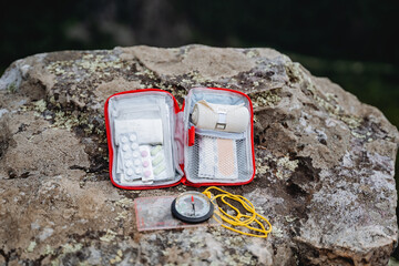 First aid kit, a set of medicines on a trip, a tactical set of drugs, a compass for orientation on...