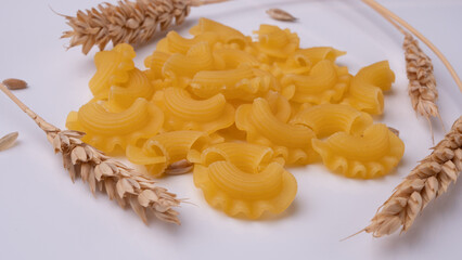 A composition of pasta and ears of wheat