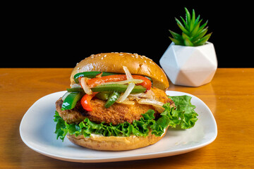 chicken patty sandwich  with sauteed peppers and onion