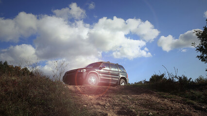 off-road car lit gently by the sun's rays © jarizPJ
