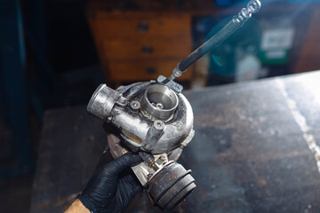 car engine turbine in oil soot.