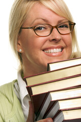 Smiling Blonde Female Student Rests Her Chin on a Stack of Books