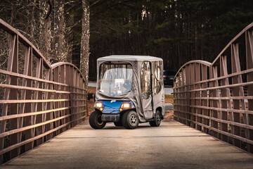 Golf cart on a bridge in Peachtree City, Georgia. Special path for them.