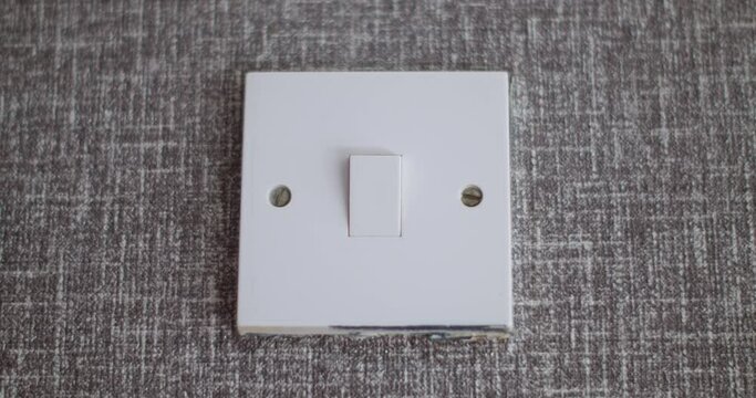 Switch on and off push button on the wall  | Electricity swich on and off used by  the  hand