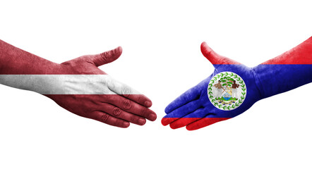 Handshake between Belize and Latvia flags painted on hands, isolated transparent image.