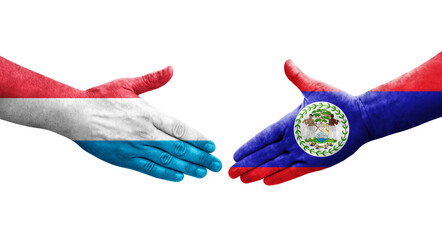 Handshake between Belize and Luxembourg flags painted on hands, isolated transparent image.